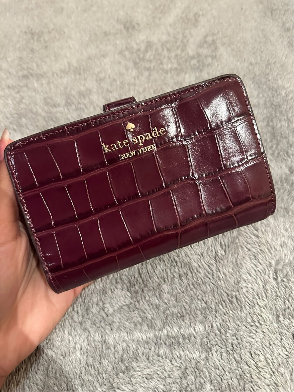 kate spade glossy croc-embossed wine wallet